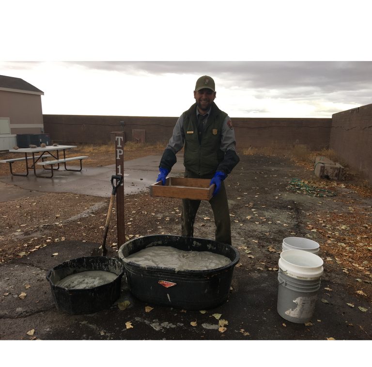 Photo courtesy of Sarah HervePetrified Forest National Park Paleontologist Adam Marsh (pictured) demonstrates how the mudstone that contains the rock is melted down in the water then put through a series of screens to remove the silt that surrounds the bones leaving them with coprolites, sand and bones.