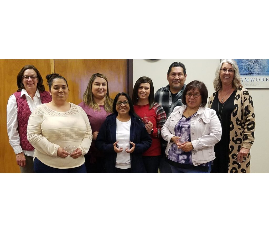 Photo by L. ParsonsThe Winslow Unified School District Governing Board and Superintendent Cyndie Mattox recognized its employees and volunteers of the months of November and December. They include (front row, left to right) CeCe Donnelly, Maria Perales, Josephine Begay (back row) Kimberly Gould, Lisette Quintana, Amber Martinez, Larry Oso and Mattox. Also recognized was Deb Fulton (not pictured).