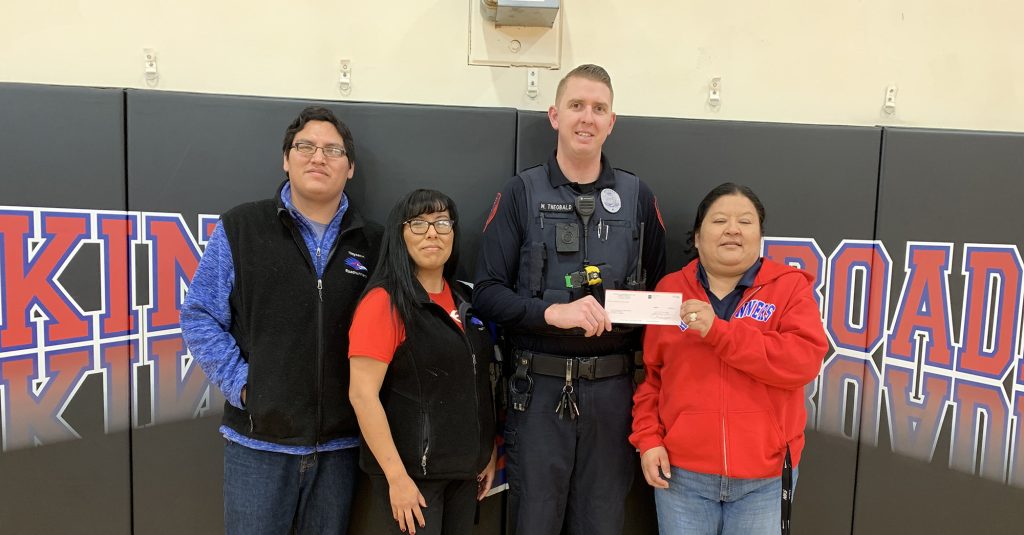 Photo courtesy of Holbrook Police Department The Holbrook Police Department was the recipient of a donation in the amount of $15,000 from the Tiisyaakin Residential Hall in Holbrook. Pictured are (left to right) recreational technician Maurice Joe, receptionist Laverne Joe, HPD Officer Matthew Theobald and Executive Director Renee White-Alcott.