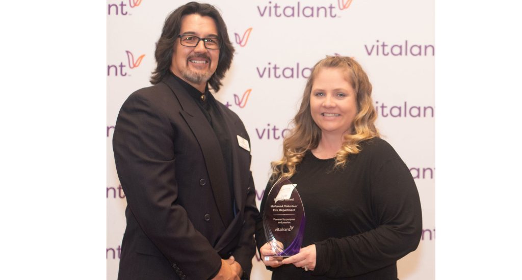 Photo courtesy of Nicole YoungNicole Young (right) was honored at the Vitalant awards banquet in Phoenix for her efforts in organizing blood donations. Young is pictured with Vitalant Southwest Division President Tom Choi (left).