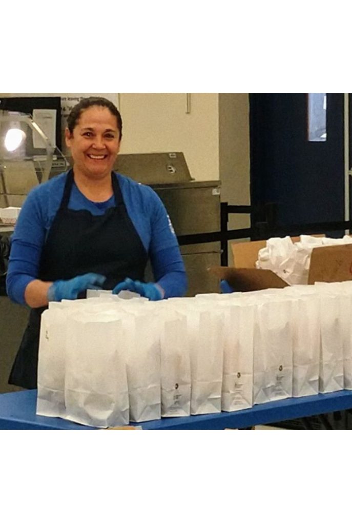 Photo courtesy of Holbrook Unified School DistrictHolbrook Unified School District employee Alejandrina Torres, was one of the many employees willing to help feed the youth in the community by preparing breakfast and lunch bags for pick-up at the district last week. All school districts in the area, including those in Winslow, Joseph City and Snowflake-Taylor are providing free meals for kids while schools are closed.