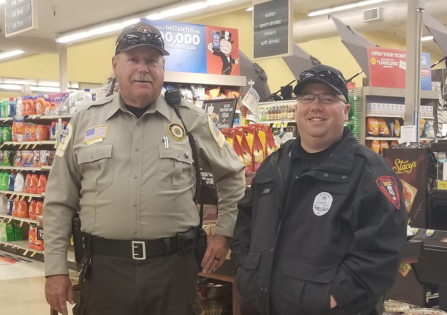 Photo by China CassidySergeant Jed Koon (right) and Navajo County Sheriff’s Auxiliary Volunteer Doyce Stuart (left) showed up at Safeway on Friday, March 20, to see that shoppers get through their trip without any mishaps following last Thursday’s early morning rush.