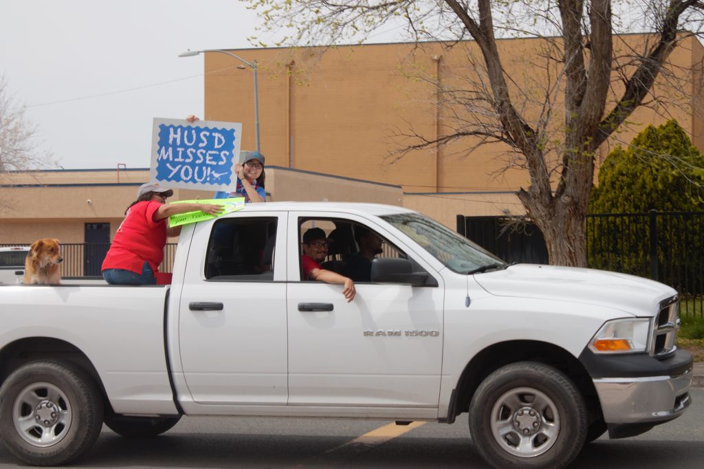 Photos by China CassidyTeachers got on board as (left to right) fourth grade teacher Jessica Paz, special education teacher Saraphania Benally, Victor Paz of the HUSD maintenance department and Hunter Byron joined several other teachers and personnel for a parade around the town to say hello to the students.