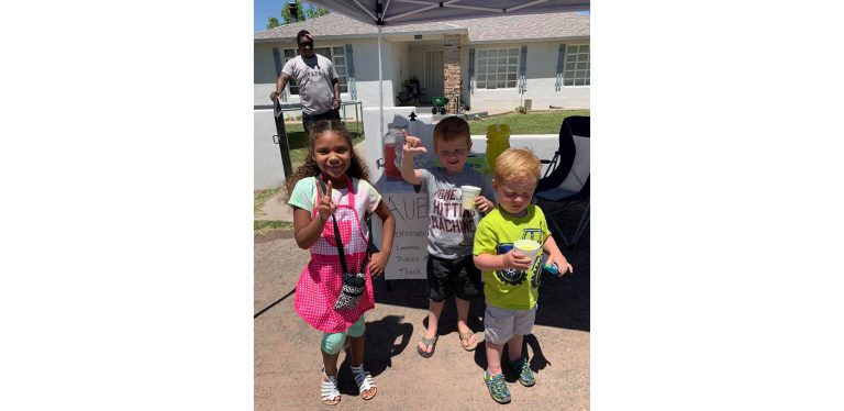 Photo by Kristal HayesIt may not be summer yet but the heat sure makes it feel like it and entrepreneur Aubrey Hayes (left) made the most of it by opening up shop. She sold lemonade, pickles, jawbreakers and Rice Krispy treats at a stand outside her house, bringing in plenty of customers including brothers Logan (center) and Tyson Gardner (right).