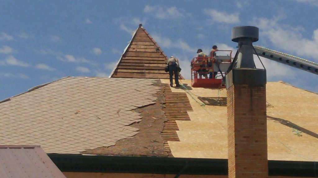 Photo by Tom SladeThe long-awaited replacement of the roof of the historic Navajo County Courthouse in Holbrook has begun. The courthouse was originally built in 1898 shortly after Navajo County was formed, with a wood shingle roof and that was last repaired in 1929 with asbestos shingles that are now on top of those original wood shingles.