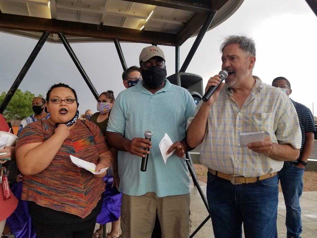 Photo by L. ParsonsA community choir led by Brenda Graham sang “We are the World,” in support of the community and police officers. Members of the choir included (left to right) Shayna Reyes, Councilman Kerwin Lawrence and Mayor McCauley.