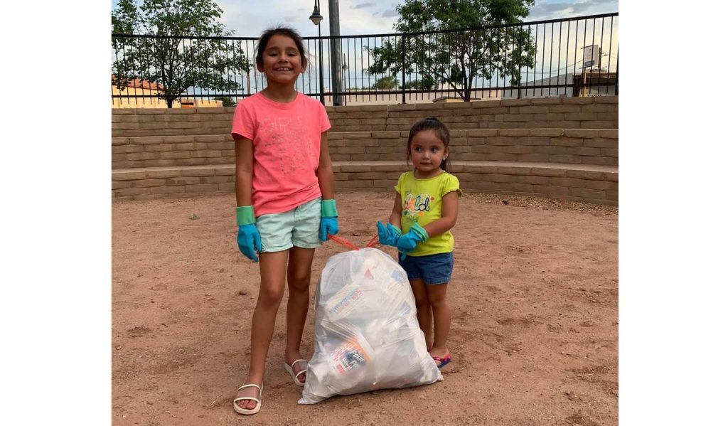 Photo courtesy PJ GabaldonWhile rock hunting with her mom and younger sister, 8-year-old Aaliyah Quintana (left) noticed that the Historic Navajo County Courthouse had trash debris spread throughout the property and decided to do something about it. She and her younger sister 3-year-old Sadie (right) made it their mission that day to rid the property of alcohol containers, old newspapers and other garbage that littered the property.