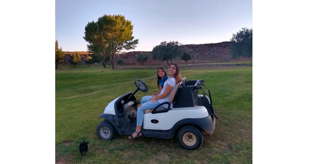 Photo Courtesy of Shar GutteryThe Holbrook City Council approved the purchase of 12 used golf carts last week. Many of the older golf carts are in constant need of maintenance and more are needed to accommodate frequent visitors of the course like Hailey Guttery (front) who enjoyed one of her final evenings in Holbrook at the Hidden Cove Golf Course with her younger sister Willow Guttery (back), and their fur baby Diesel before heading off to college in Tucson for her freshman year.