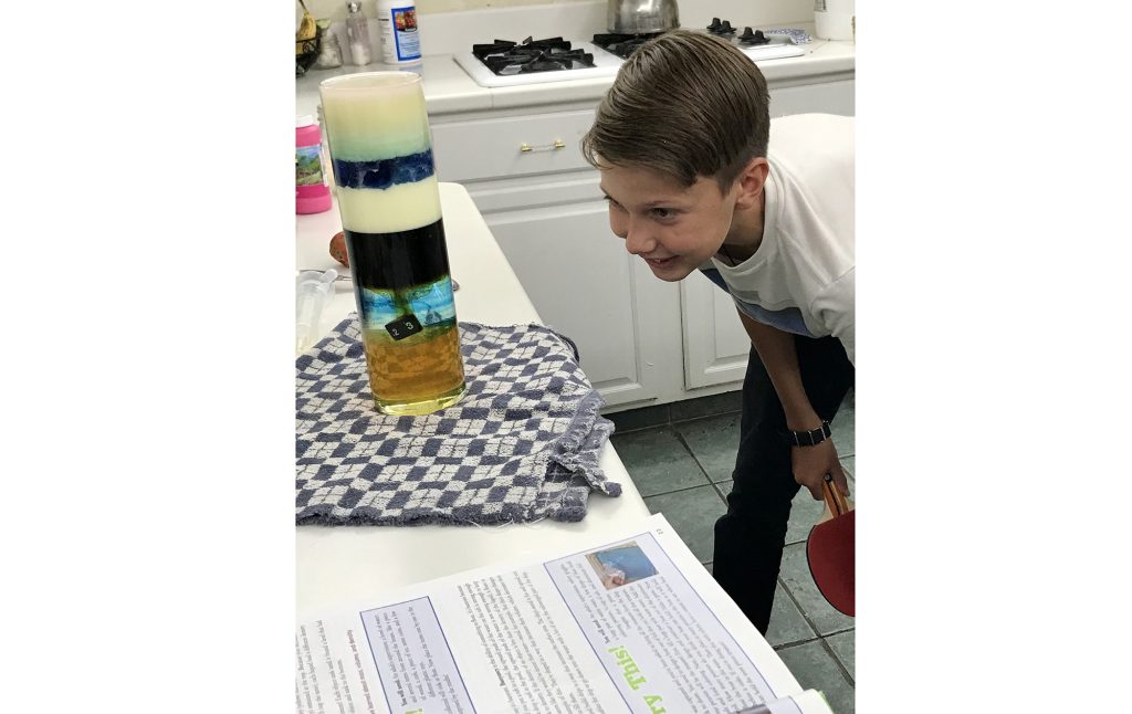 Photo courtesy of Sandy FoutzAs many area families decide to continue schooling from home even after schools open, what that education will entail is a new task to consider. Here 13-year-old Geoff Foutz (pictured) of Holbrook can be seen enjoying a density experiment did as part of his curriculum from home.