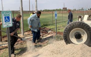 Photo courtesy of the City of WinslowCity of Winslow Public Works employees (left to right) Robert Kaufman, Mike Spex and Dave Dalton work to build the infrastructure for the drive-in movie hosted Friday night.