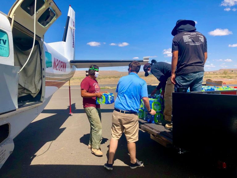 Photo courtesy of the Navajo and Hopi Families COVID-19 Relief FundVolunteers unload supplies transported by Air Serv International, which has to delivered 48,193 pounds of supplies to remote corners of the Navajo and Hopi nations.