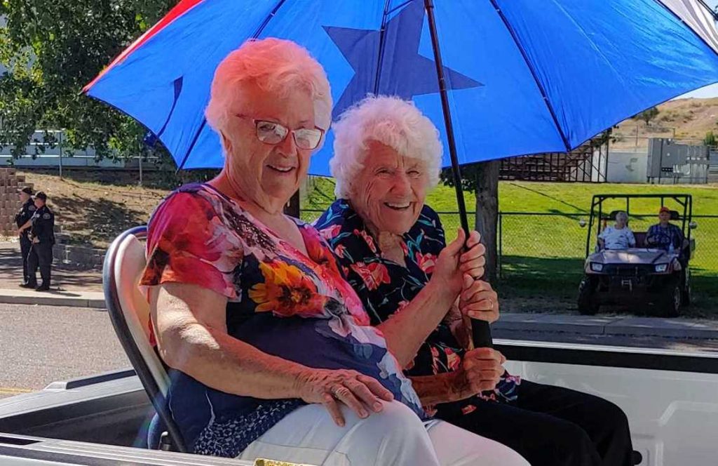 Photos courtesy of the Snowflake/Taylor Chamber of CommerceGrand marshals Katy Udall (left) and Shirley Cole (right) wave to parade goers during the Sweet Corn Festival Parade. Grand Marshal Carmen Shumway was not present.