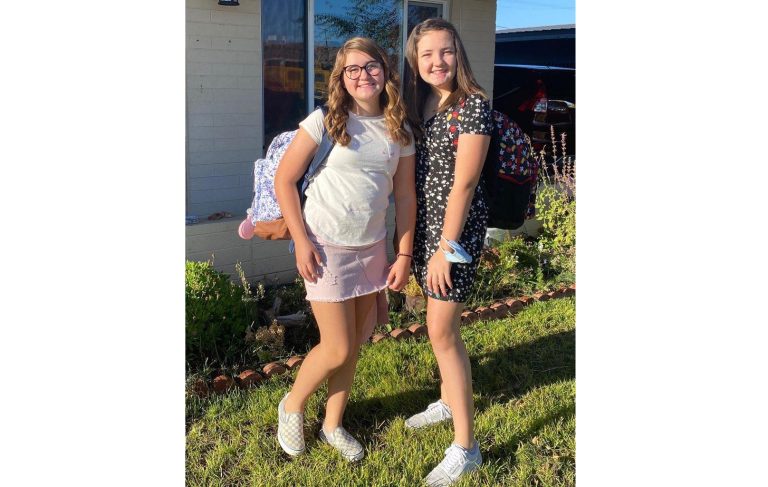 Photo courtesy of Arcenia PachecoHolbrook Junior High School seventh grader Jaycee Greer, 12, (left) and eighth grader, Socorro Pacheco, 13, (right) were all smiles returning to school after nearly six months on day one of in-person learning on Monday, Sept 14.
