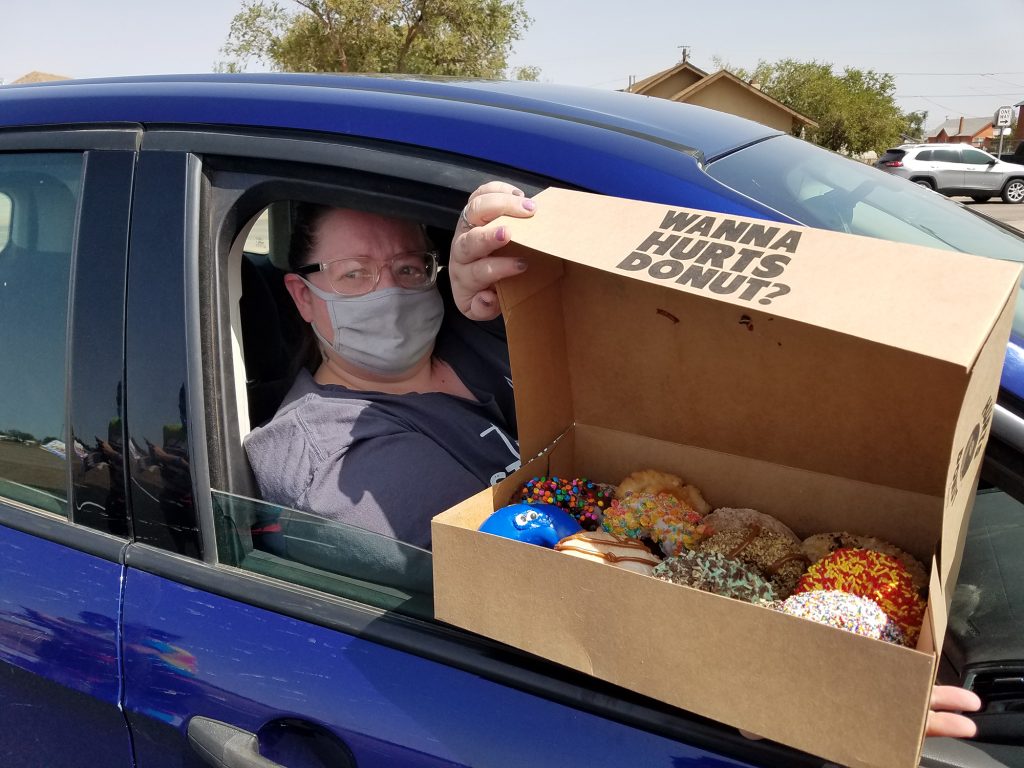 Photos by L. ParsonsCharleigh Betts (pictured) was the first in line for the Hurts Donut delivery in Winslow last Wednesday. The Tempe based company brought their unique pastries to town to help fundraise for a block party sponsored by the City of Winslow.