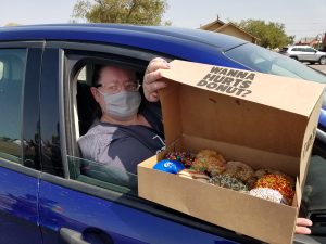 Photos by L. ParsonsCharleigh Betts (pictured) was the first in line for the Hurts Donut delivery in Winslow last Wednesday. The Tempe based company brought their unique pastries to town to help fundraise for a block party sponsored by the City of Winslow.