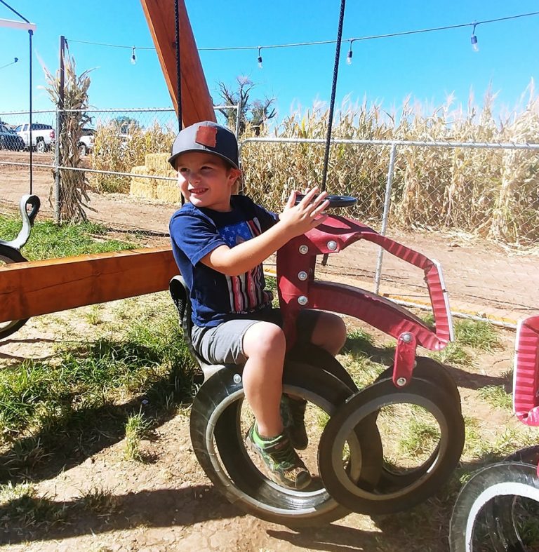 Photo by Rebecca SladeA sure sign fall is here is when Willis Farms in Snowflake is selling pumpkins and the maze is open for visitors. Holbrook resident James Mitchell (pictured) enjoyed a day of fun on the farm with a ride on the tractor swing.