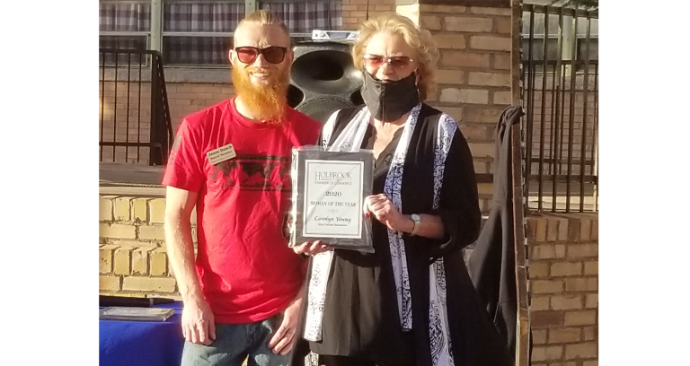 Photo by China CassidyLast Friday, Nov. 20, the Holbrook Chamber of Commerce held their annual community awards with Carolyn Young (right) the owner of the Mesa Italiana Restaurant honored as Businesswoman of the Year, with board member Jason Dench (left) presenting.