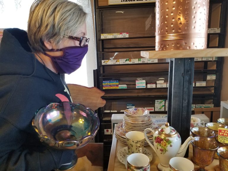 Photo by L. ParsonsWinslow resident Terri Parsons finds treasures as she shops at the city’s latest retail addition, the More Than a Corner Thrift Store.