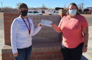 Photo courtesy of Winslow Junior High SchoolWinslow Junior High School Principal Deb Lopez (left) presented Winslow BPOE Elk’s Lodge member Michelle Pennington (right) with a check for $247 last week. Students and staff at the school raised money through their “Put a Cap on Hunger” program. The money will be used to help fund the annual Elk’s Christmas Baskets program in which the Lodge supplies holiday meals and toys to underprivileged families in Winslow.