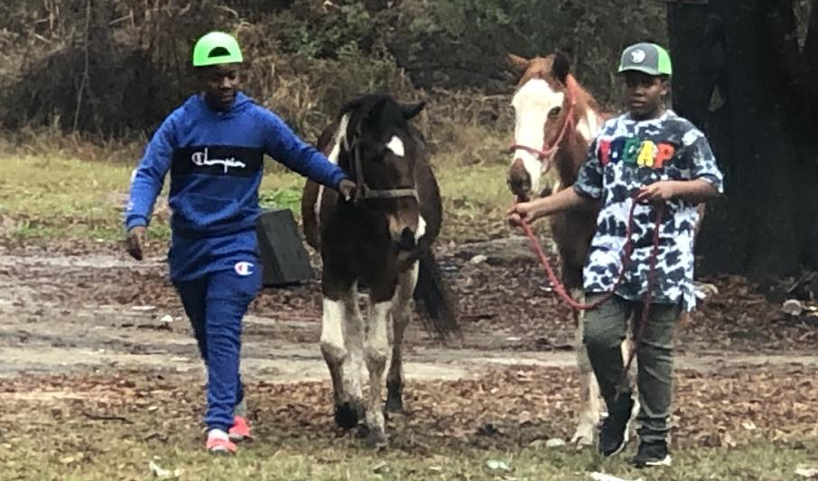 Photo Courtesy of Alan PalmerMarzavious Bradford’s (right) enjoys his new horse Rudolph with his big brother Marquavious (left). The boy’s wish to own a horse came true after reaching out to Alan Palmer, who has the YouTube channel The Farm on Route 66, and telling him how much he’s been wanting a horse of his own.