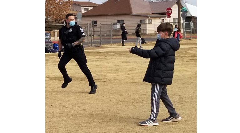 Photo by L. ParsonsWinslow Police Officer Alejandro Barron (left) joined in a game of kickball with fifth grader Deacon Hairrell (right) at Washington Elementary School last week. Although community policing has changed due to COVID, opportunities such as this are an important part of police work and community trust.