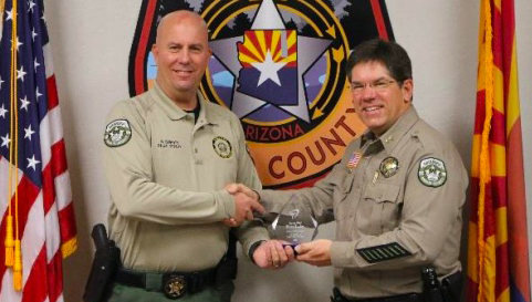 Photo courtesy of Navajo County Sheriff’s OfficeNCSO Chief Deputy Brian Swanty (left) presents Deputy Chief Bruce Tucker (right) with the David’s Hope Award for promoting mental health education for those in law enforcement.