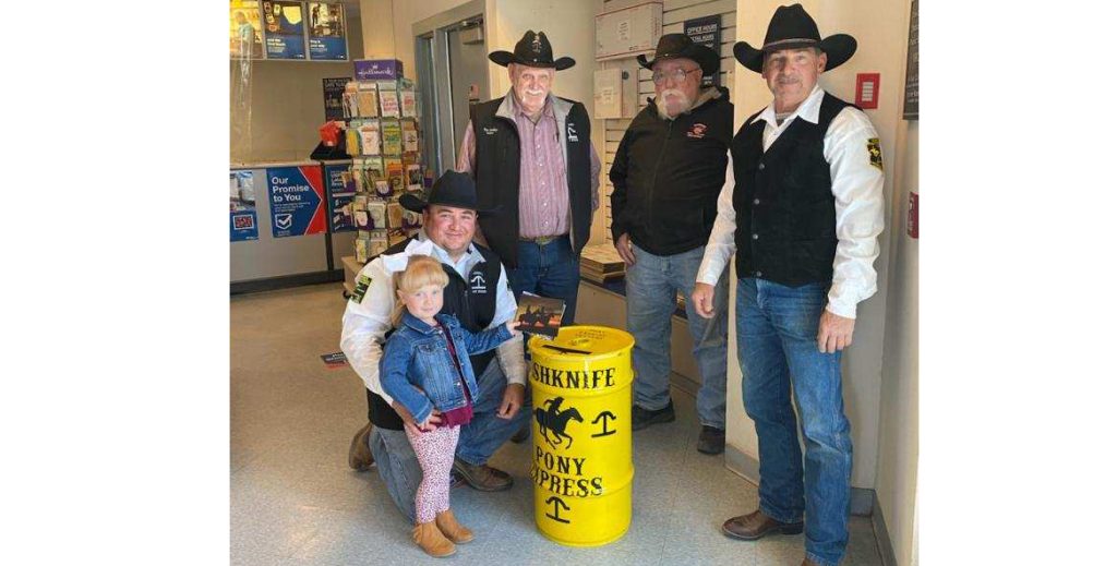 Photo by Ashly HayesThe Hashknife Posse is preparing for the 63rd annual Pony Express Ride slated for April 14 by setting barrels out to collect letters that will be delivered via horseback for the postal service. Here Hadley Hayes (far left) drops in the first letter at the Holbrook Post Office with the help of dad Gary Hayes while (left to right) Jim Mobley, Bill Perkins and Tim Kelley look on. Barrels have been placed at area post offices including in Winslow, Joseph City, Taylor, Heber, Overgaard, Show Low and Pinetop, as well as at the Navajo County Historic Courthouse in Holbrook. The last day to put a letter in a barrel will be by 5 p.m. on Tuesday, April 13.