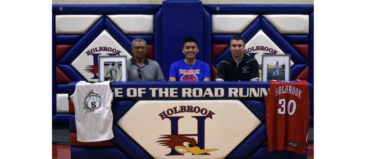 Photo courtesy of Holbrook High SchoolHolbrook Roadrunner Malik Bahe (center) signed his letter of intent to attend Northland Basketball Club System and attend classes at Northland Pioneer College. He is pictured with Chinle Head Coach Raul Mendoza (left) and Holbrook assistant Coach Jeremy Madison (right).