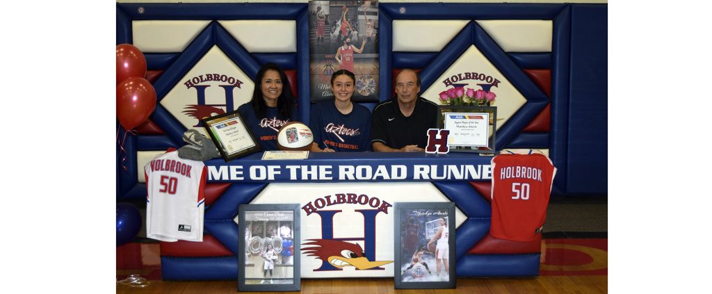 Photo courtesy of Holbrook High SchoolHolbrook's Lady Roadrunner Matehya Aberle (center) recently signed her letter of intent and her scholarship offer to attend and play basketball at Pima Community College this fall. Her coaches Elisha Johns-Aberle (left) and Greg Perkins (right) are pictured with her at her signing day.