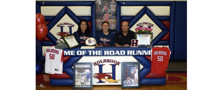 Photo courtesy of Holbrook High SchoolHolbrook's Lady Roadrunner Matehya Aberle (center) recently signed her letter of intent and her scholarship offer to attend and play basketball at Pima Community College this fall. Her coaches Elisha Johns-Aberle (left) and Greg Perkins (right) are pictured with her at her signing day.