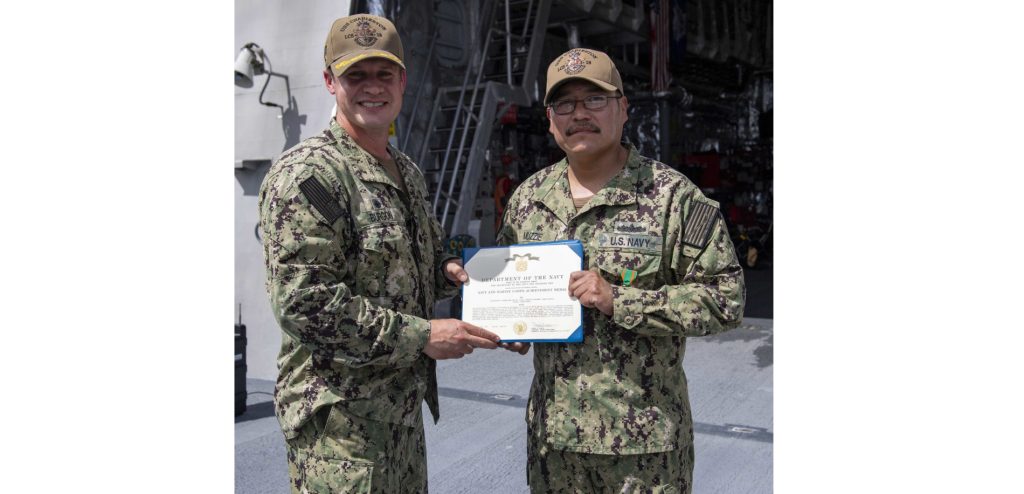 Photo by Mass Communication Specialist 3rd Class Adam Butler APRA HARBOR, Guam (May 21, 2021) Electronics Technician 2nd Class Shane Muzzie (right) from Piñon, Ariz., received the Navy Achievement Medal from Cmdr. Joseph Burgon (left) aboard Independence-variant littoral combat ship USS Charleston (LCS 18), May 21. Charleston, part of Destroyer Squadron Seven, is on a rotational deployment operating in the U.S. 7th Fleet area of operation to enhance interoperability with partners and serve as a ready response force in support of a free and open Indo-Pacific region.