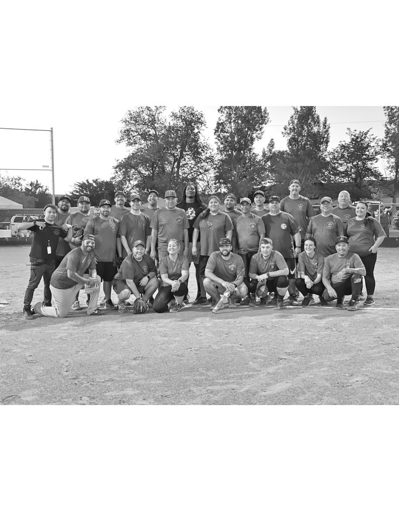 Photos by Nicole YoungMembers of the Holbrook Police Department, Holbrook Volunteer Fire Department and EMS are pictured here with Lenny Jones, professional football player who, after playing all day with the kids wanted to play on the police side for the game for the charity softball event. Pictured are (front row, left to right) Mark Saxton, Ray Patterson, Rebecca Slade, Scott Baker, Jacob Baker, Sabrina Peck and Adrian Padilla, (middle row) Omar Ventura, Alex Baldonado, Jordan Smith, Alex Baker, Kelly Sample, Byron Shelendewa, Mark Oberriter, Jed Koon, PJ Gabaldon, (back row) Paul Saiz, Kendall Bakurza, Mike Young, Allen Mitchell, Lenny Jones, James Saxton, Trent Larson, Matthew Theobald and Josh Minnick. The Fire Department won the series 2 games to 0. Game 1, 16-15, game 2, 21-12.