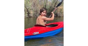 Photo by Lorey ThomasWarm sunshine and cool water make for perfect summer enjoyment and Connor Thomas knows it, shown here spending time on Clear Creek in Winslow in his kayak. The creek is a popular recreation area for locals and visitors to boat, hike and picnic.