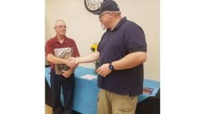 Photo by L. ParsonsThe Rotary Club of Winslow installed their new officers last week. Here, outgoing President Kevin Coolidge (left) welcomes new President Jimmy Atha (right) to the position.