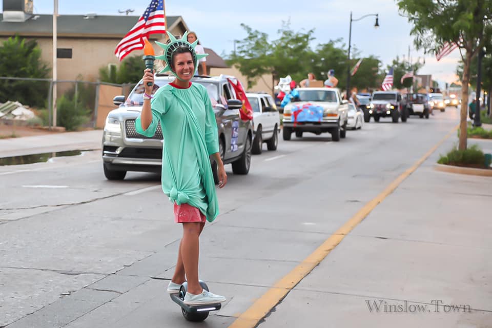 Photo by Lori LawAmy Hartnett donned her best Lady Liberty and rode the entire Fourth of July parade route on a one wheel board last week in Winslow.