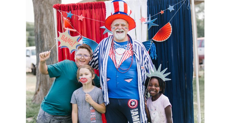 Photo by Cat HansenJeff Strong (center) was Uncle Sam and Captain America rolled into one as he entertained kids at the Joseph City Fourth of July celebration last week.