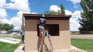 Photo courtesy of the City of HolbrookThe softball field concessions stand at Hunt Park in Holbrook has had the siding replaced and general restoration after years of neglect. Here employee Michael Young is shown completing the work.