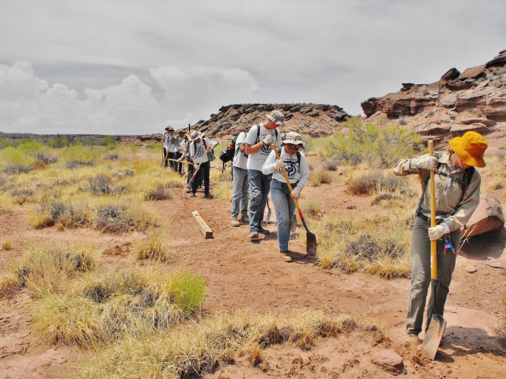 Photo by Michael O’DellThe Youth Conservation Corps takes on many projects each year that benefit the surrounding communities of the Petrified Forest National Park. Here, the youth do trail maintenance at the Hidden Cove Petroglyph Park.