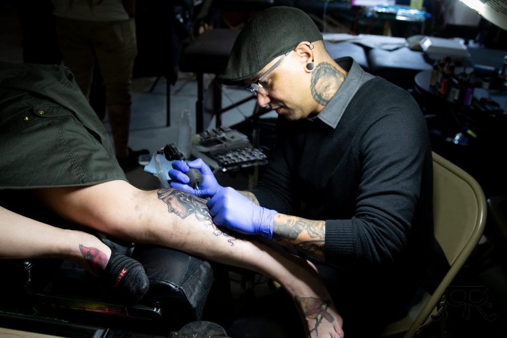 Photo by Ash ReillySierra Vista tattoo artist Michael Otero tattooing at the 2019 Inkfest event in Winslow.
