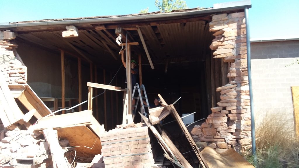 Photo courtesy of the City of HolbrookMike Young with facilities maintenance (left) and Tim Kelley (right) installed temporary bracing until a more permanent solution can be found.