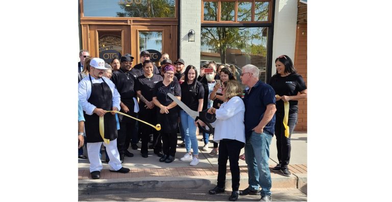 Photo by Lawrence KennaChef Chris Sanchez (left) and front of house manager Bernadette Gilbert (right) held the ribbon as the owners of Old Town Grill, Paul and Kelly Rada cut the ceremonial ribbon on their new endeavor.