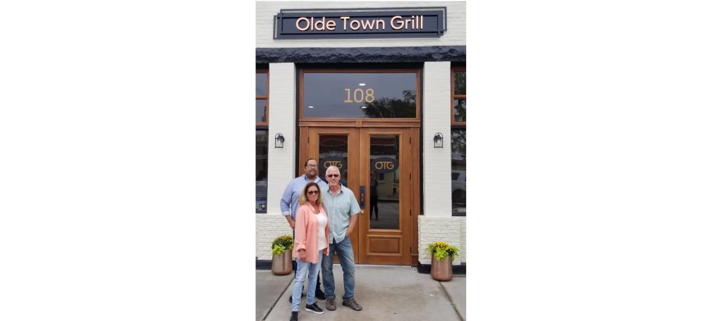Photo by L. ParsonsOwners Kelly and Paul Rada (forefront) and their son Jeffrey Grayson, who manages the restaurant, stand in front of their new restaurant, Old Town Grill, located at 108 E. Second St. in Winslow.