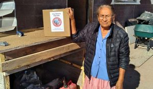 Photo courtesy of Yee Ha’ólníi DooAn elder Navajo woman receives an isolation kit as part of the Delta Relief Program to help prevent the spread of coronavirus within her community.