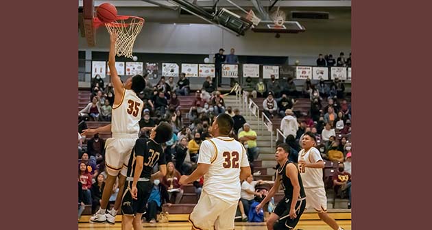 Photo by Richard LarsonThe Bulldogs lost to the Chinle Wildcats, 58-68 in a non-conference game but they still made some great plays. Here Bulldog Shiron Dale did a layup for two points.