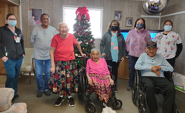 Photo courtesy of Holbrook Extended CareNurses from Winslow Indian Health Services delivered presents to the residents at Holbrook Extended Care last week. Residents pictured are (second from left to right) Harrison Gorman, Ramona Nez, Daisy Yazzie and Chee Yazzie Begay. Nurses that came bearing gifts were (left) Erica Morefield, (third from right to left) Ruby Morales, Veronica Fuson and Leandra Elthie.