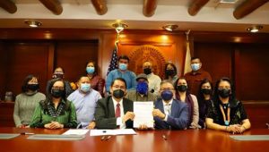Photo courtesy of the Navajo Nation office of the President and Vice PresidentNavajo Nation President Jonathan Nez (center left) and Vice President Myron Lizer (center right) sign Resolution CD-62-21 into law at the Office of the President and Vice President in Window Rock on Jan. 4.