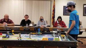 Photo by L. ParsonsJulyien Lopez (right), a fourth-grade student at Bonnie Brennan Elementary school in Winslow joined his robotics team The Brainstormers, for a presentation to the WUSD Governing Board including (left to right) President Joey Hartnett, Vice President Allen Leonard, Marlee Erven and Dodie Montoya.