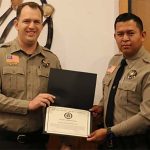 Photo courtesy of Navajo CountyNavajo County Sheriff David Clouse (left) presented an award of appreciation to Deputy Nathan Simonson (right) for his efforts in thwarting a threat at Pinion High School.