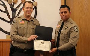 Photo courtesy of Navajo CountyNavajo County Sheriff David Clouse (left) presented an award of appreciation to Deputy Nathan Simonson (right) for his efforts in thwarting a threat at Pinion High School.