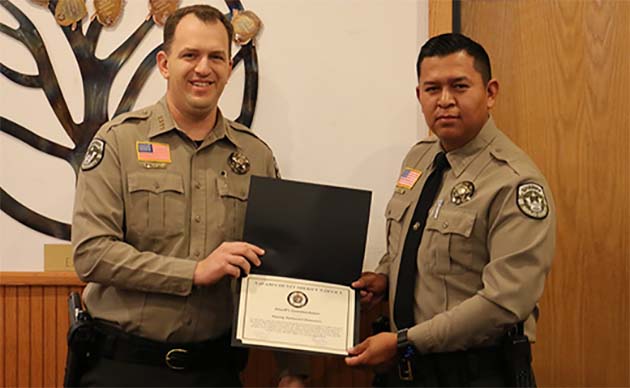 Photo courtesy of Navajo CountyNavajo County Sheriff David Clouse (left) presented an award of appreciation to Deputy Nathan Simonson (right) for his efforts in thwarting a threat at Pinion High School.